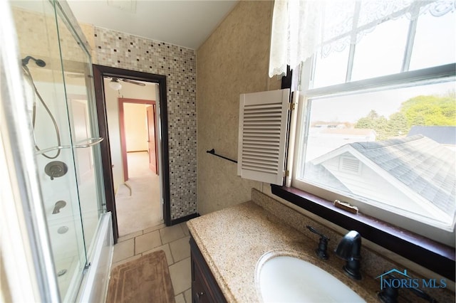 313 E Lynn St, Edgerton, OH 43517 - bathroom featuring vanity, tile patterned flooring, shower / bath combination with glass door, and ceiling fan