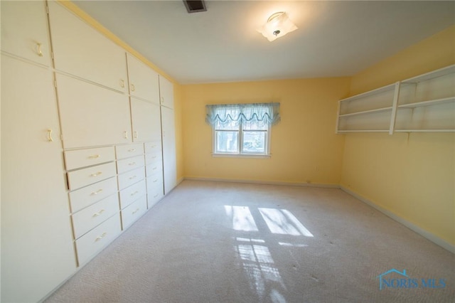 313 E Lynn St, Edgerton, OH 43517 - unfurnished bedroom with light carpet and baseboards
