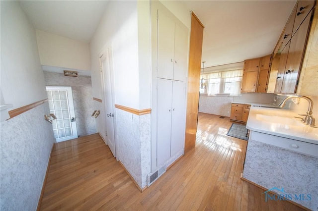 313 E Lynn St, Edgerton, OH 43517 - corridor featuring light wood-type flooring and a sink