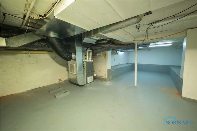 313 E Lynn St, Edgerton, OH 43517 - unfinished below grade area featuring heating unit