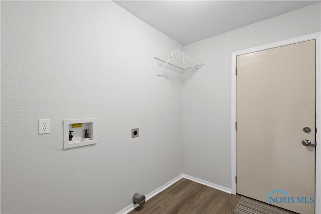 1141 Oriole Dr, Bowling Green, OH 43402 - laundry area with washer hookup, dark wood-style flooring, electric dryer hookup, and baseboards