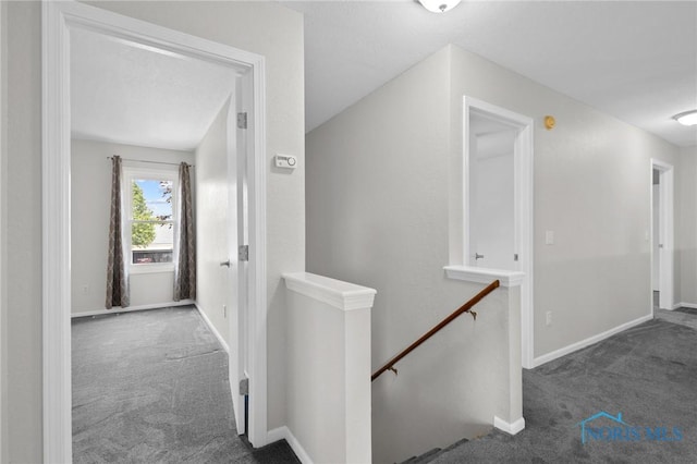 1141 Oriole Dr, Bowling Green, OH 43402 - hallway with an upstairs landing, carpet, and baseboards