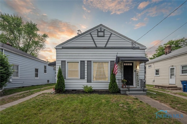 3255 Sherbrooke Rd, Toledo, OH 43606 - shotgun-style home featuring a front yard