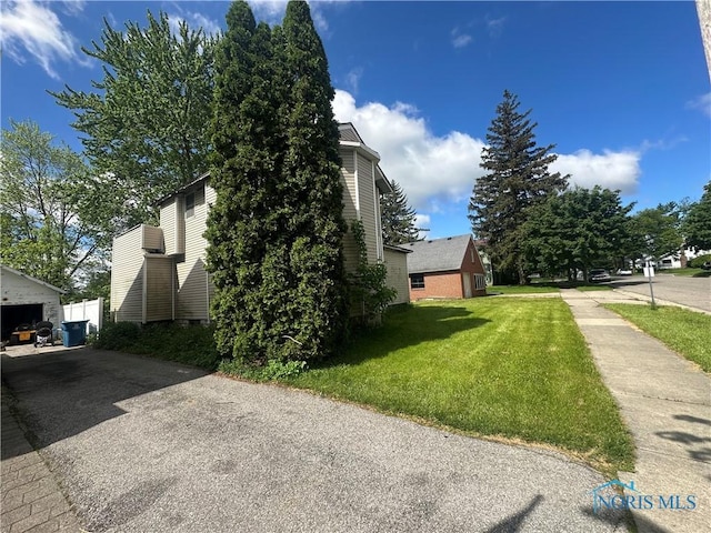 316 E Mulberry St, Bryan, OH 43506 - view of side of property with a yard