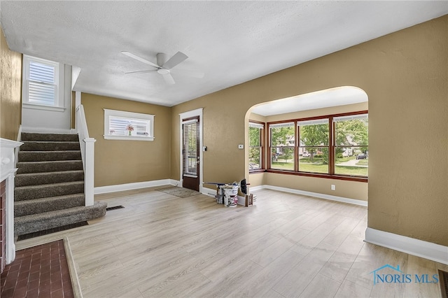 345 W Manhattan Blvd, Toledo, OH 43608 - entryway with ceiling fan, arched walkways, stairway, healthy amount of natural light, and a textured ceiling