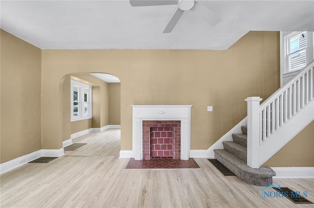 345 W Manhattan Blvd, Toledo, OH 43608 - entrance foyer with wood finished floors, arched walkways, a ceiling fan, baseboards, and stairway