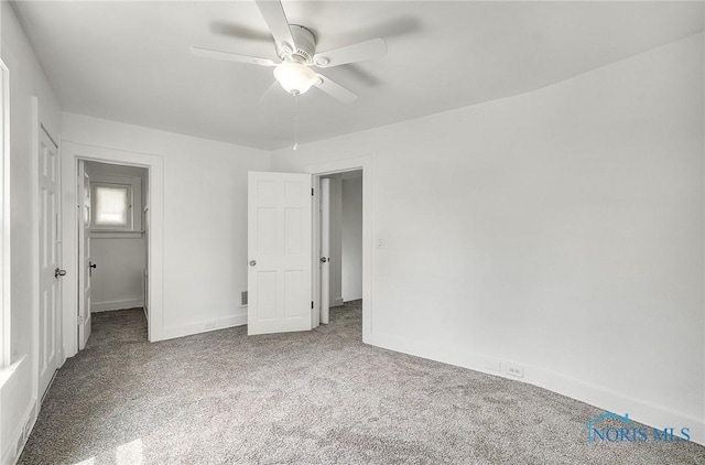 345 W Manhattan Blvd, Toledo, OH 43608 - unfurnished bedroom featuring carpet floors, baseboards, and ceiling fan