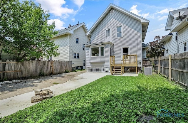 345 W Manhattan Blvd, Toledo, OH 43608 - back of property featuring central AC unit and a wooden deck