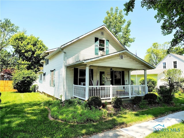 1050 Schultz St, Defiance, OH 43512 - view of front of property featuring covered porch and a front yard