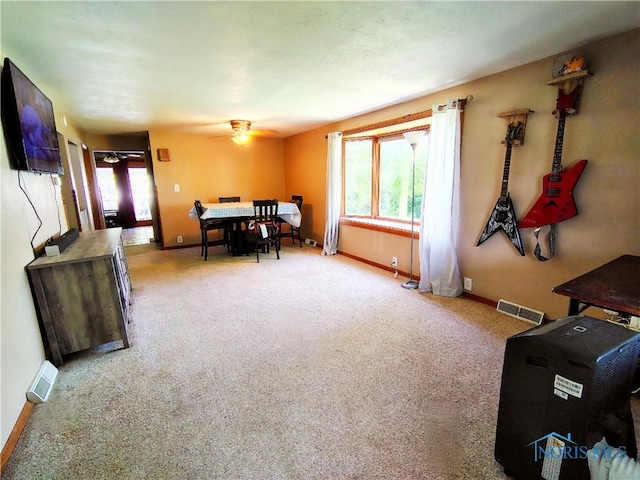 1050 Schultz St, Defiance, OH 43512 - carpeted dining room featuring a ceiling fan and baseboards