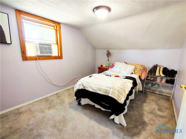 1050 Schultz St, Defiance, OH 43512 - bedroom featuring carpet, baseboards, vaulted ceiling, a textured ceiling, and cooling unit