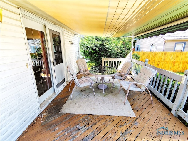 1050 Schultz St, Defiance, OH 43512 - wooden deck featuring outdoor dining area