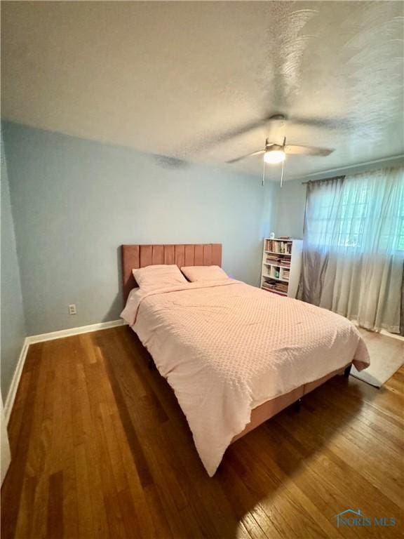 309 Koerber Dr, Defiance, OH 43512 - bedroom with wood finished floors, a ceiling fan, and a textured ceiling