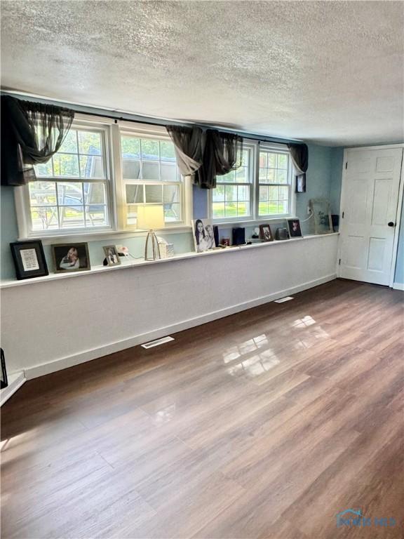 309 Koerber Dr, Defiance, OH 43512 - interior space featuring a textured ceiling and wood finished floors