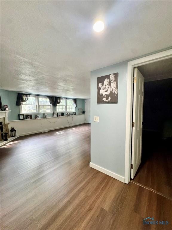 309 Koerber Dr, Defiance, OH 43512 - unfurnished living room with wood finished floors and a fireplace
