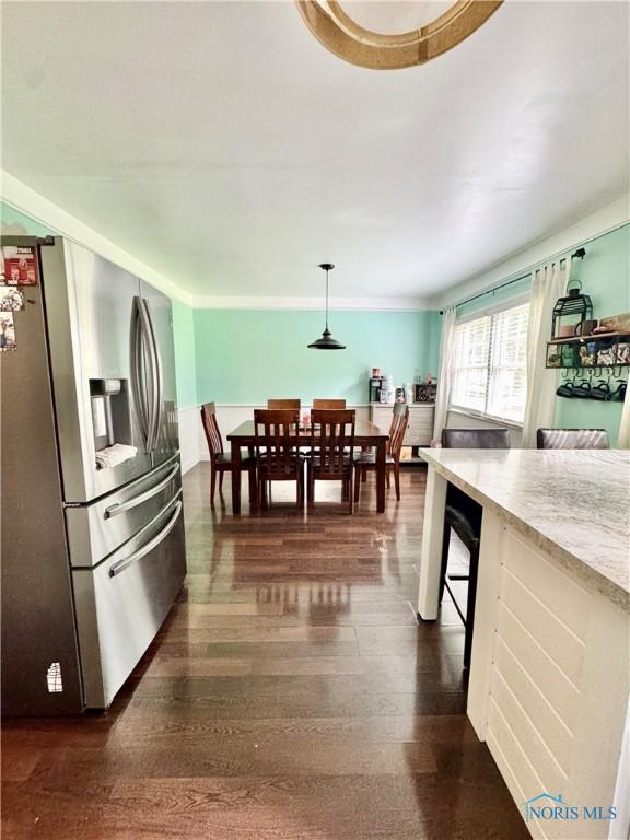 309 Koerber Dr, Defiance, OH 43512 - kitchen featuring stainless steel fridge with ice dispenser, dark wood-style floors, and decorative light fixtures