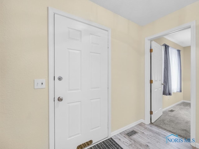 1104 Bernath Pkwy, Toledo, OH 43615 - entryway with baseboards and light wood-style flooring