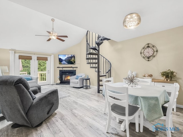 1104 Bernath Pkwy, Toledo, OH 43615 - living area with stairway, wood finished floors, a ceiling fan, and vaulted ceiling