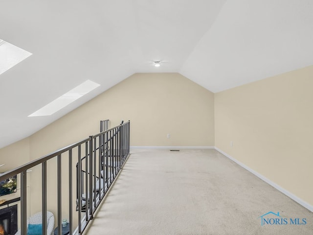 1104 Bernath Pkwy, Toledo, OH 43615 - bonus room with a skylight, carpet floors, vaulted ceiling, and baseboards