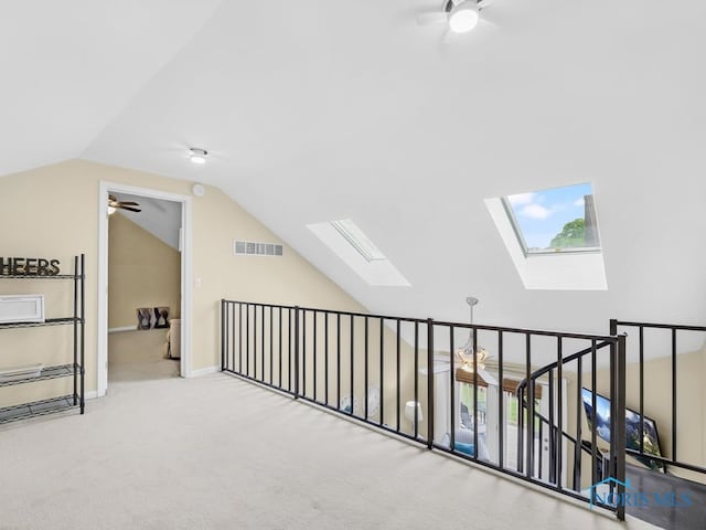 1104 Bernath Pkwy, Toledo, OH 43615 - additional living space featuring a skylight, a ceiling fan, vaulted ceiling, and carpet