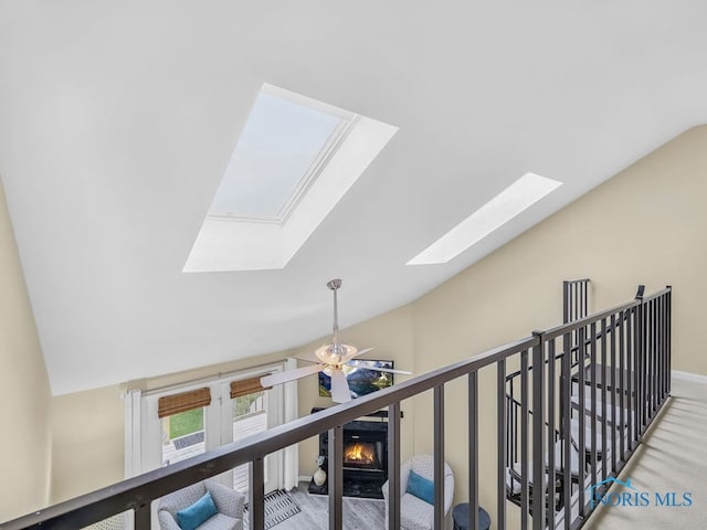 1104 Bernath Pkwy, Toledo, OH 43615 - hall with vaulted ceiling, a skylight, and baseboards