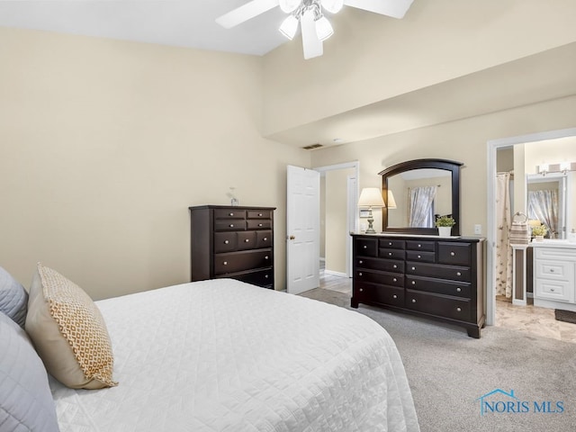 1104 Bernath Pkwy, Toledo, OH 43615 - bedroom featuring carpet, a ceiling fan, and ensuite bath
