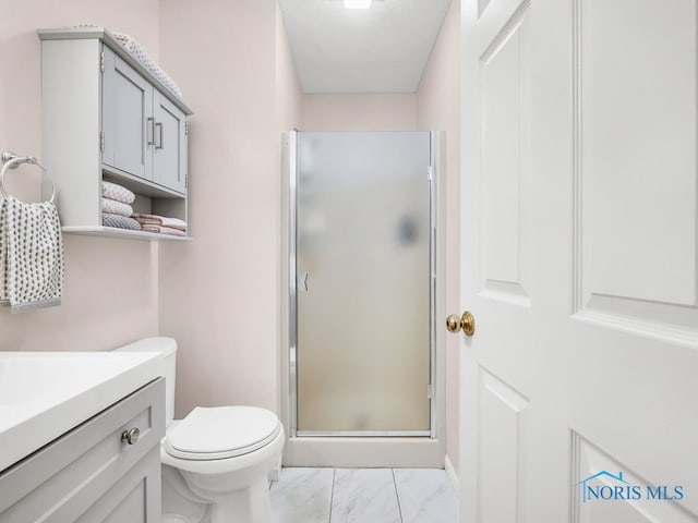1104 Bernath Pkwy, Toledo, OH 43615 - full bathroom with a stall shower, marble look tiles, vanity, and toilet