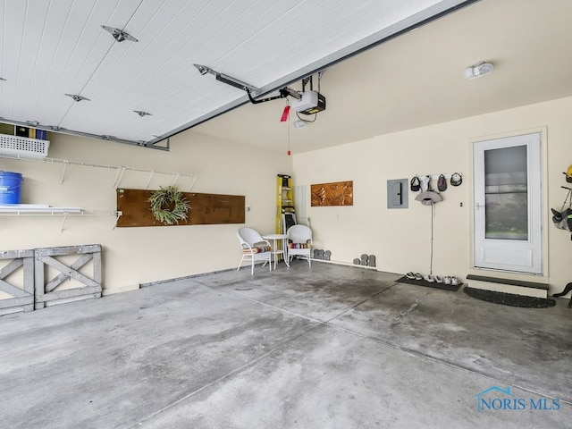 1104 Bernath Pkwy, Toledo, OH 43615 - garage featuring electric panel and a garage door opener
