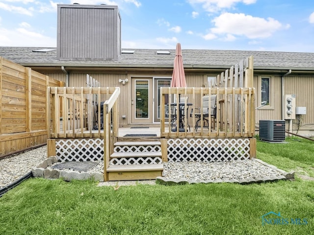 1104 Bernath Pkwy, Toledo, OH 43615 - back of property featuring central AC unit, a deck, a chimney, and roof with shingles
