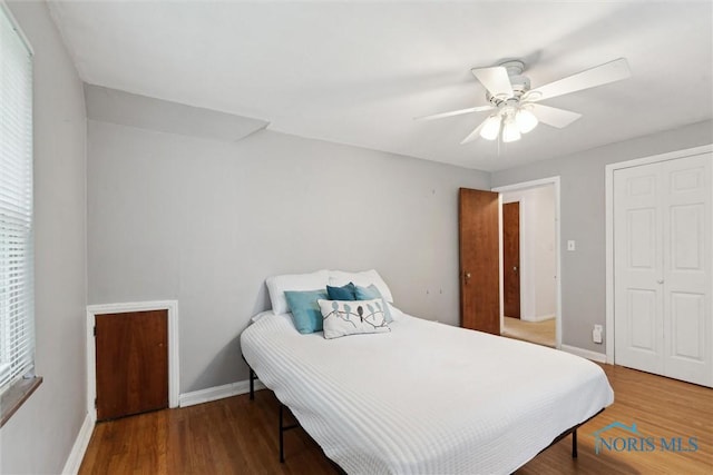 3127 Drummond Rd, Toledo, OH 43606 - bedroom with baseboards, wood finished floors, ceiling fan, and a closet