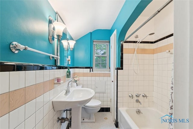 3127 Drummond Rd, Toledo, OH 43606 - full bathroom with toilet, lofted ceiling,  shower combination, tile patterned flooring, and tile walls