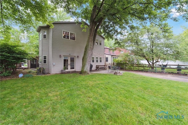 3127 Drummond Rd, Toledo, OH 43606 - back of house featuring french doors and a patio