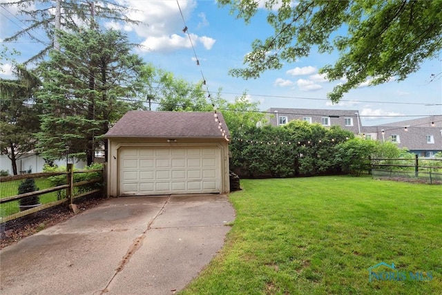 3127 Drummond Rd, Toledo, OH 43606 - view of yard featuring an outdoor structure and a garage