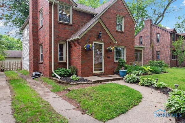 3127 Drummond Rd, Toledo, OH 43606 - view of front of house featuring brick siding and a shingled roof