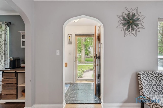 3127 Drummond Rd, Toledo, OH 43606 - entryway with arched walkways, baseboards, and wood finished floors