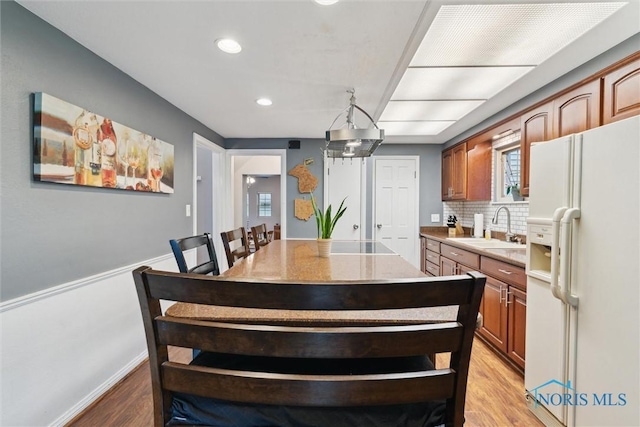 3127 Drummond Rd, Toledo, OH 43606 - dining space featuring light wood-style floors, recessed lighting, and a wainscoted wall