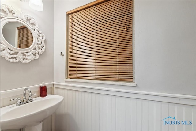 3127 Drummond Rd, Toledo, OH 43606 - bathroom with a sink and a wainscoted wall