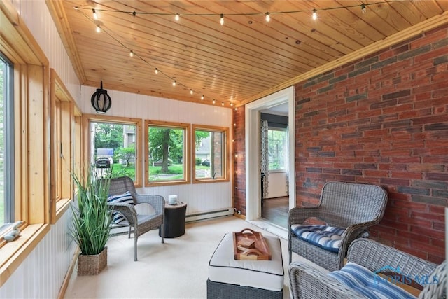 3127 Drummond Rd, Toledo, OH 43606 - sunroom featuring a baseboard radiator, healthy amount of natural light, wooden ceiling, wooden walls, and brick wall