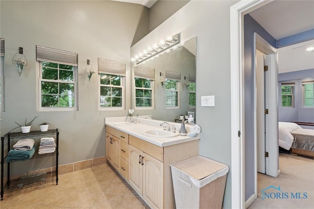 3127 Drummond Rd, Toledo, OH 43606 - ensuite bathroom with double vanity, baseboards, and tile patterned floors