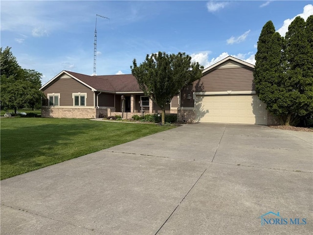 24340 Hull Prairie Rd, Perrysburg, OH 43551 - ranch-style house with driveway, a front yard, and a garage