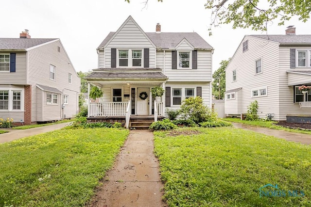 3819 Rushland Ave, Toledo, OH 43613 - view of front of house featuring covered porch and a front lawn