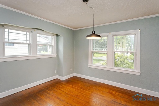 3819 Rushland Ave, Toledo, OH 43613 - spare room with wood-type flooring, crown molding, a textured ceiling, and a textured wall