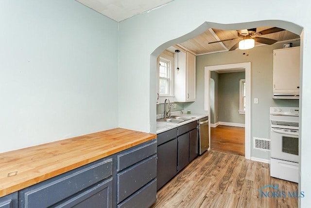 3819 Rushland Ave, Toledo, OH 43613 - kitchen featuring arched walkways, electric stove, stainless steel dishwasher, a ceiling fan, and light wood finished floors