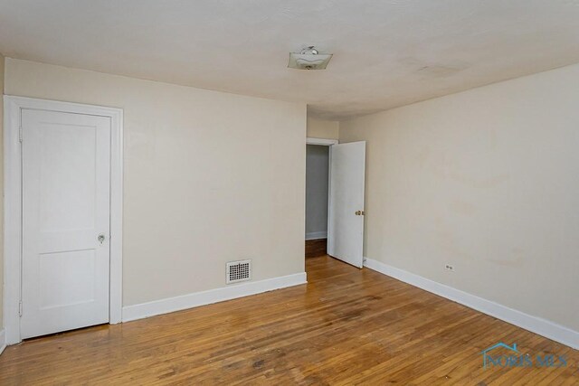 3819 Rushland Ave, Toledo, OH 43613 - empty room with baseboards and wood finished floors