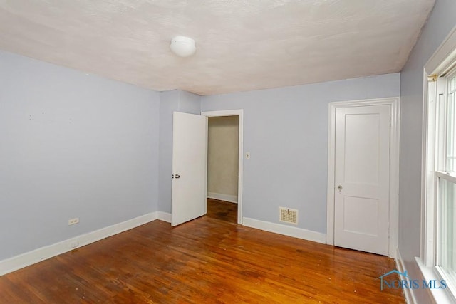 3819 Rushland Ave, Toledo, OH 43613 - unfurnished bedroom with wood finished floors and baseboards