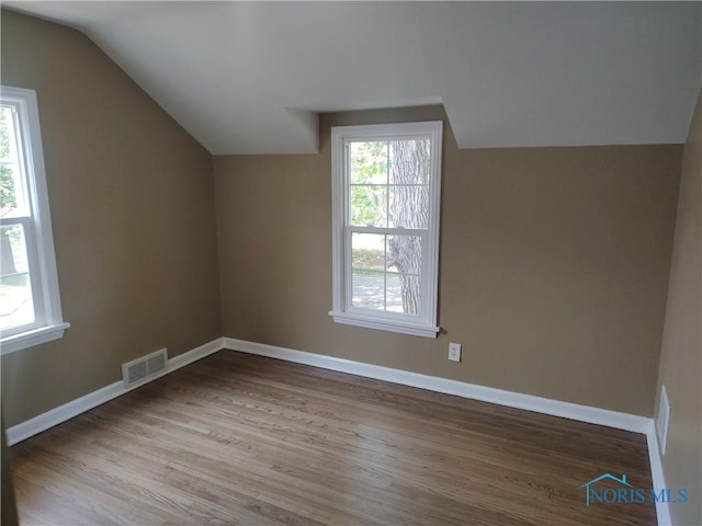 2417 Lambert Dr, Toledo, OH 43613 - additional living space featuring lofted ceiling, wood finished floors, and baseboards