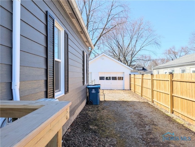 726 S Lynn St, Bryan, OH 43506 - view of yard with a detached garage, driveway, and an outdoor structure
