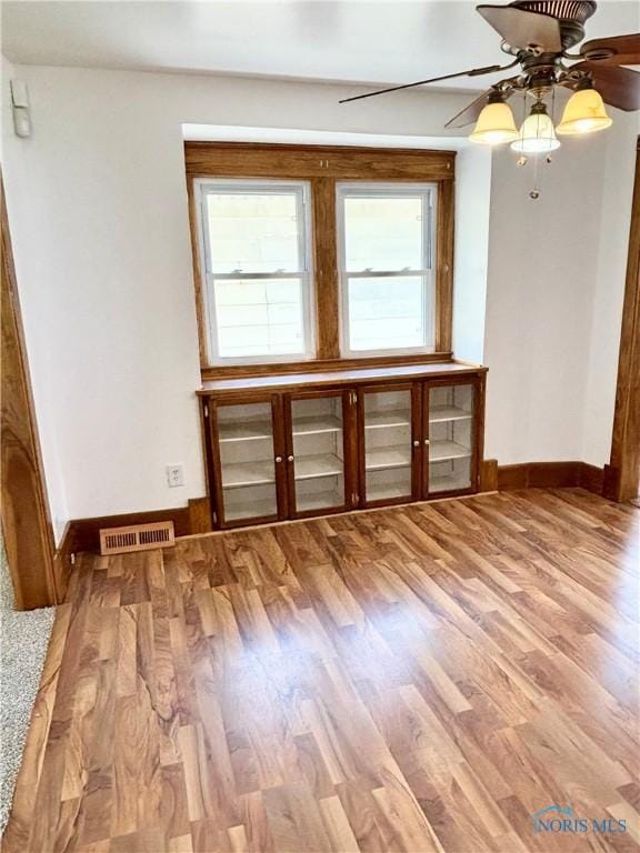 1522 Nevada St, Toledo, OH 43605 - unfurnished room featuring baseboards, a ceiling fan, and wood finished floors
