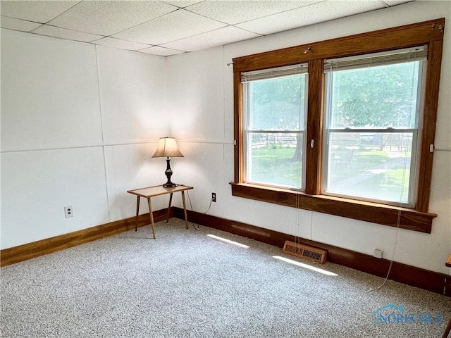 1522 Nevada St, Toledo, OH 43605 - carpeted spare room featuring healthy amount of natural light, baseboards, and a drop ceiling