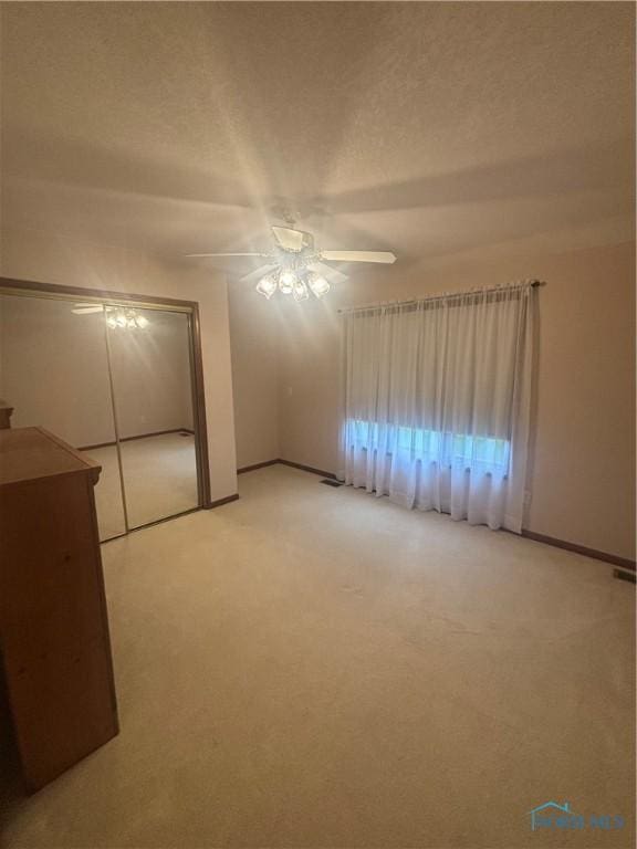6134 Cemetery Rd, Whitehouse, OH 43571 - unfurnished bedroom featuring light carpet and a ceiling fan